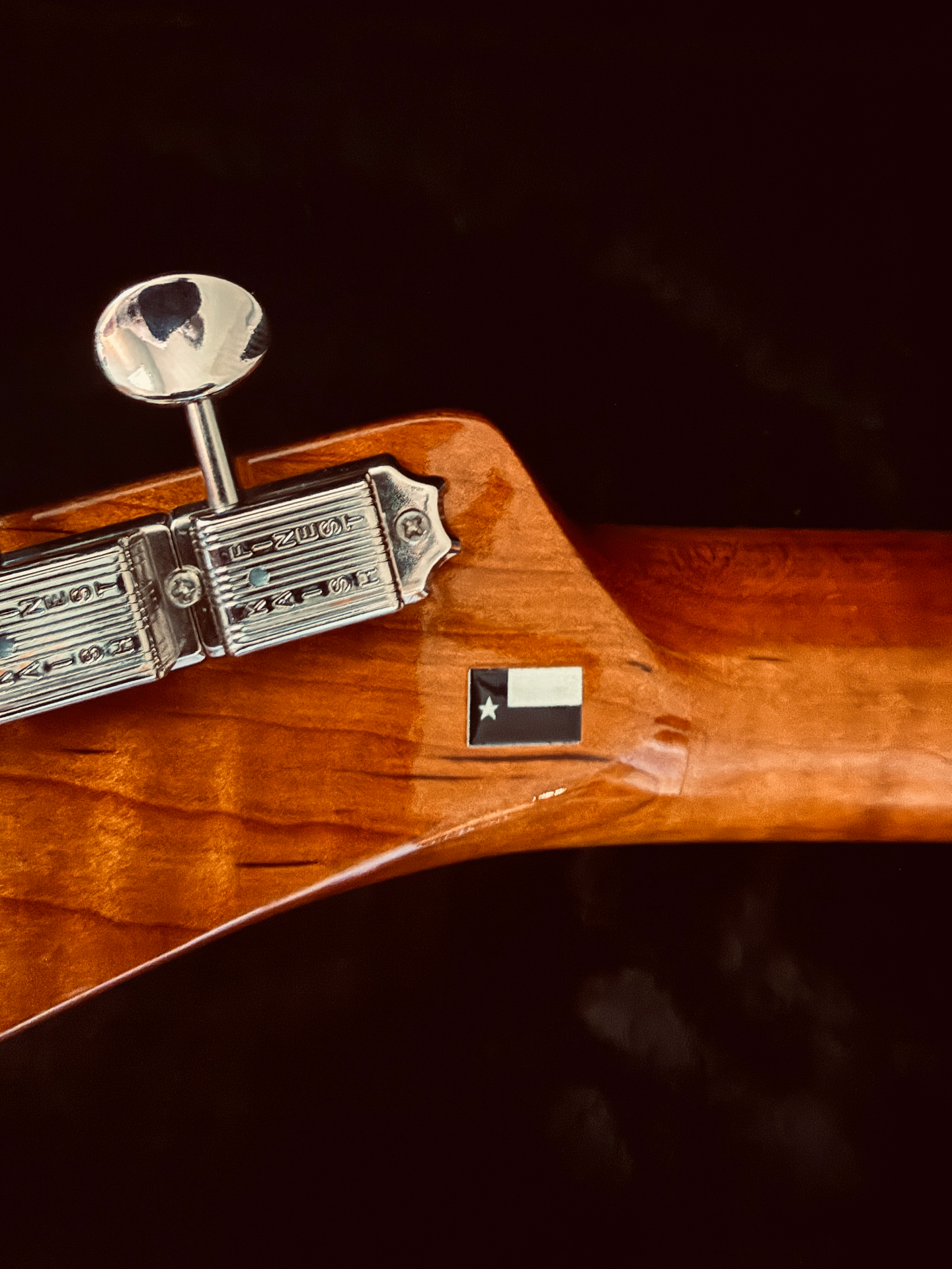 Handmade headstock with a Texas flag inlay — built in Austin, Texas